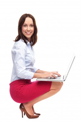 Woman wearing red skirt, working on computer